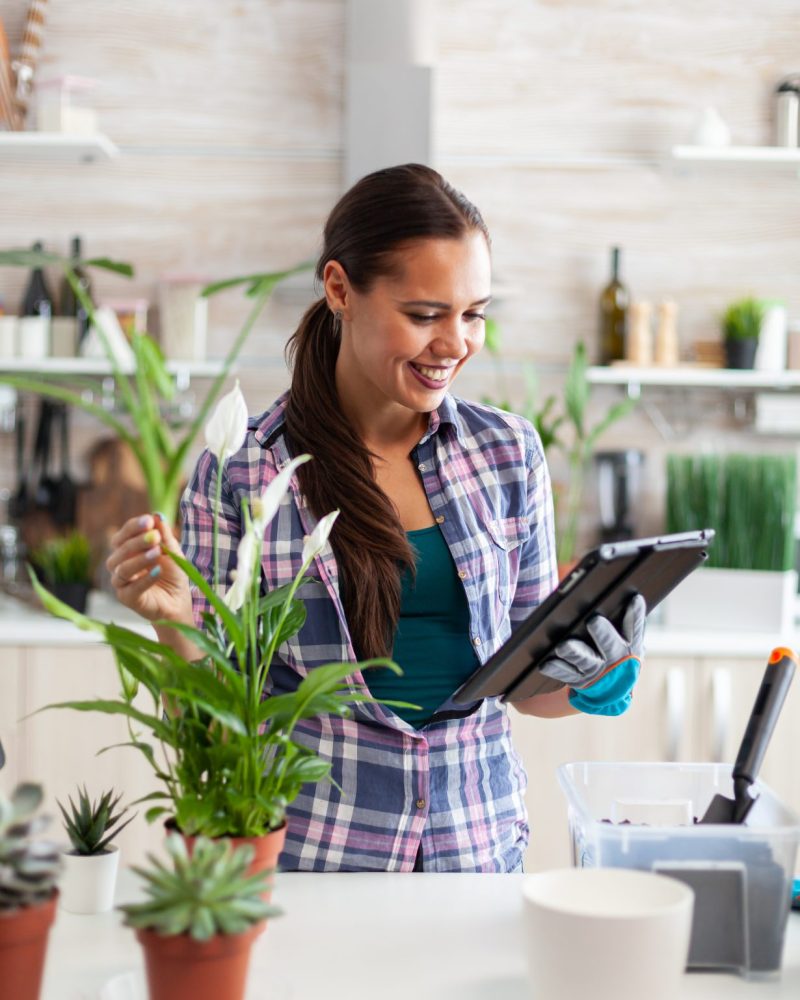 housewife-reading-about-soil-flowers-gardening-home (1)